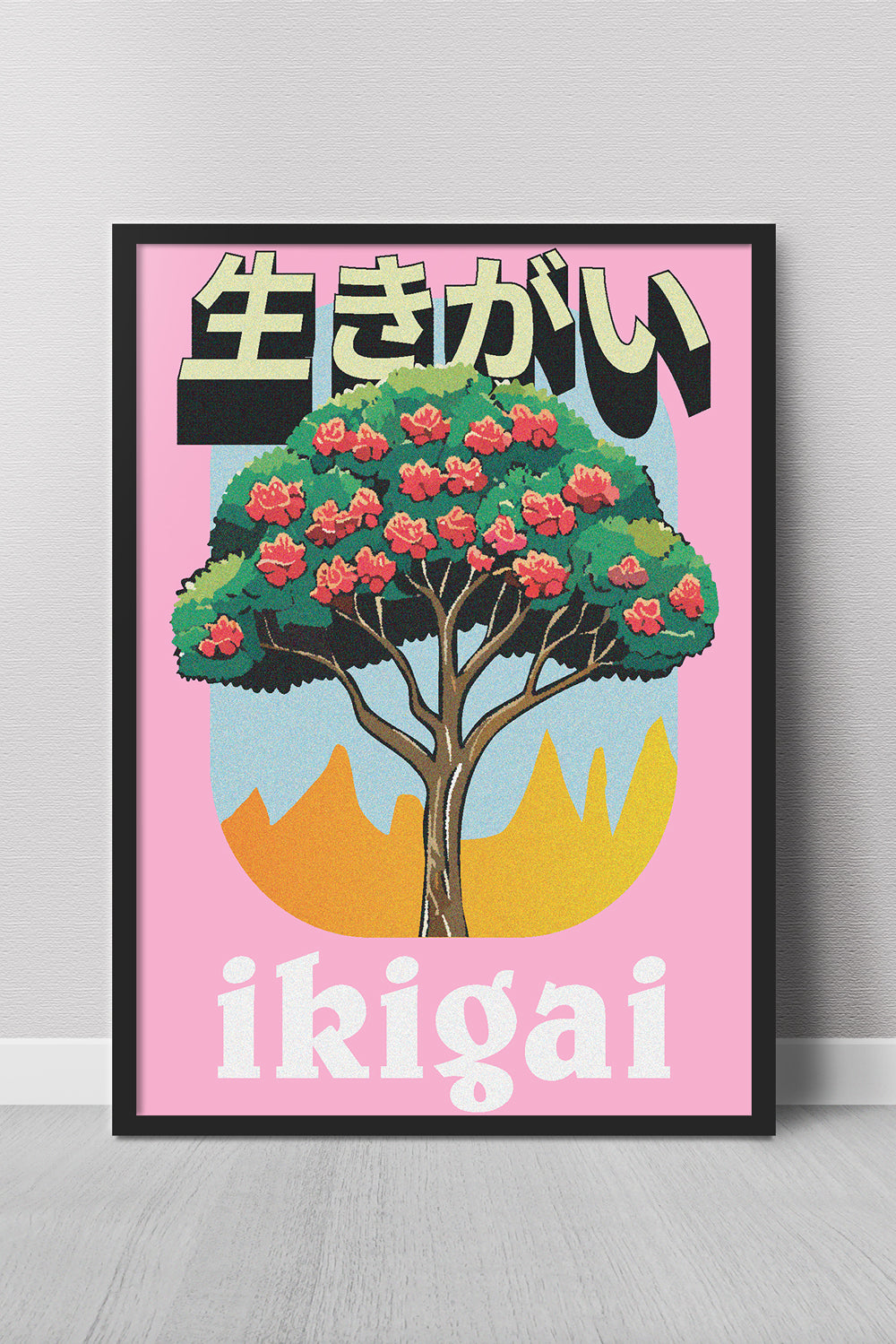 Framed artwork with a tree and 'ikigai' text on a pink background