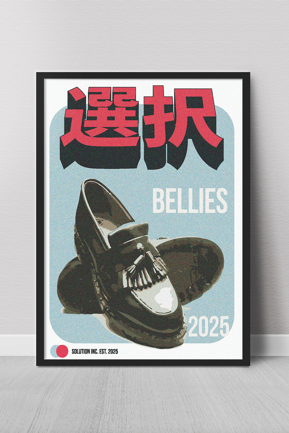 Framed poster with black shoes, red and black text, and 'BELLIES' branding on a light gray background.
