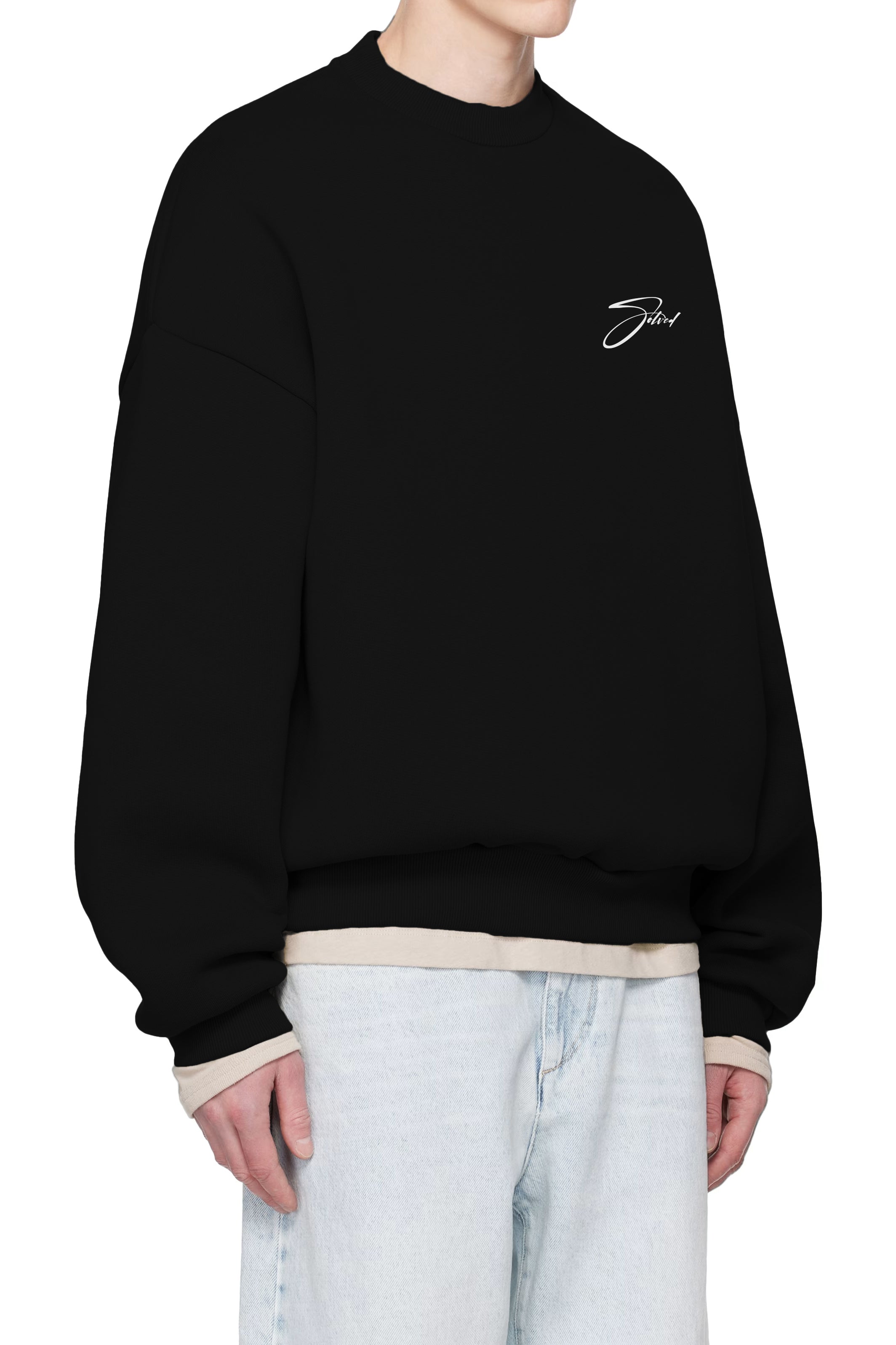 Black sweatshirt with a small logo on the chest worn by a person, white background