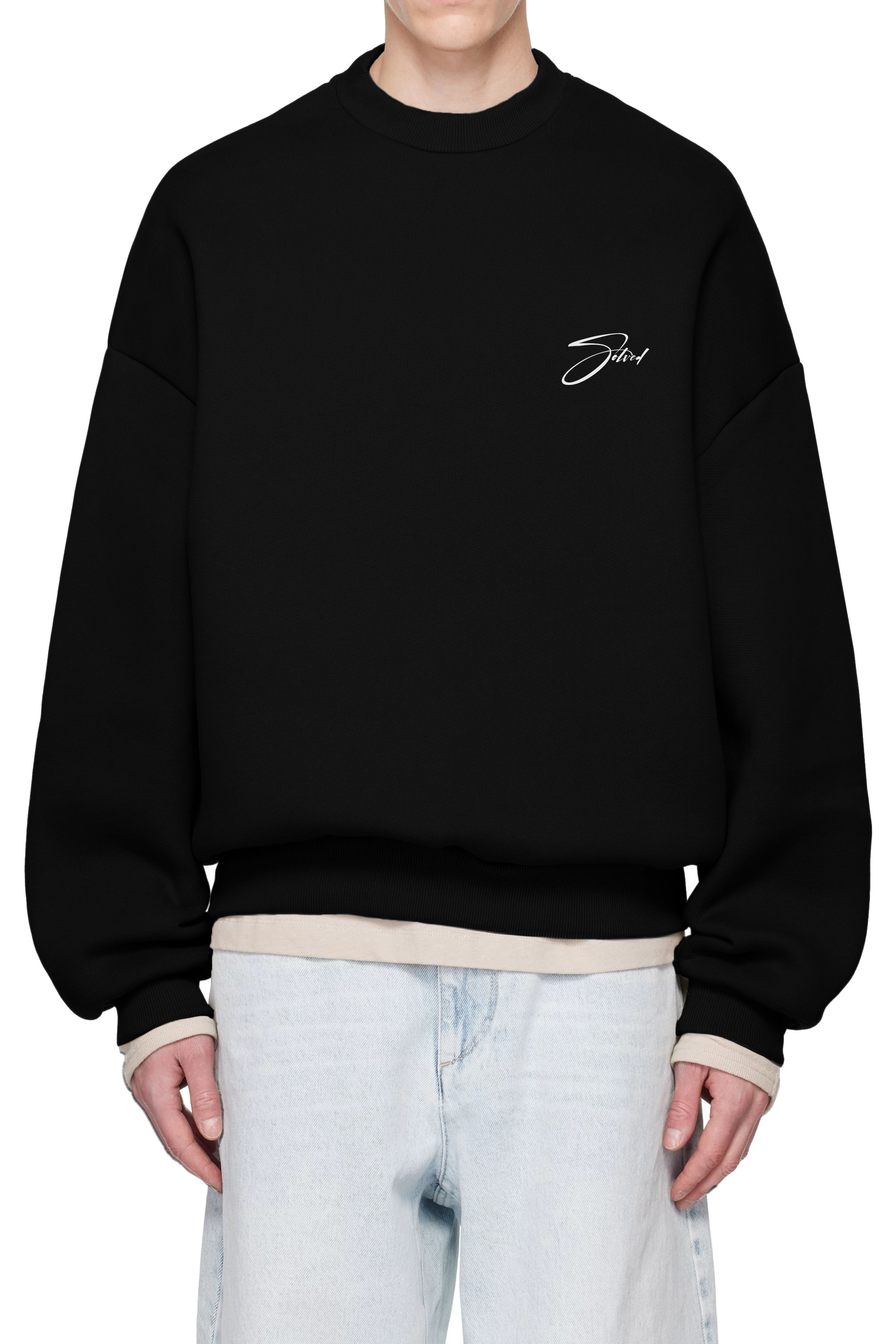 Black sweatshirt with a logo on the chest worn by a person, against a white background