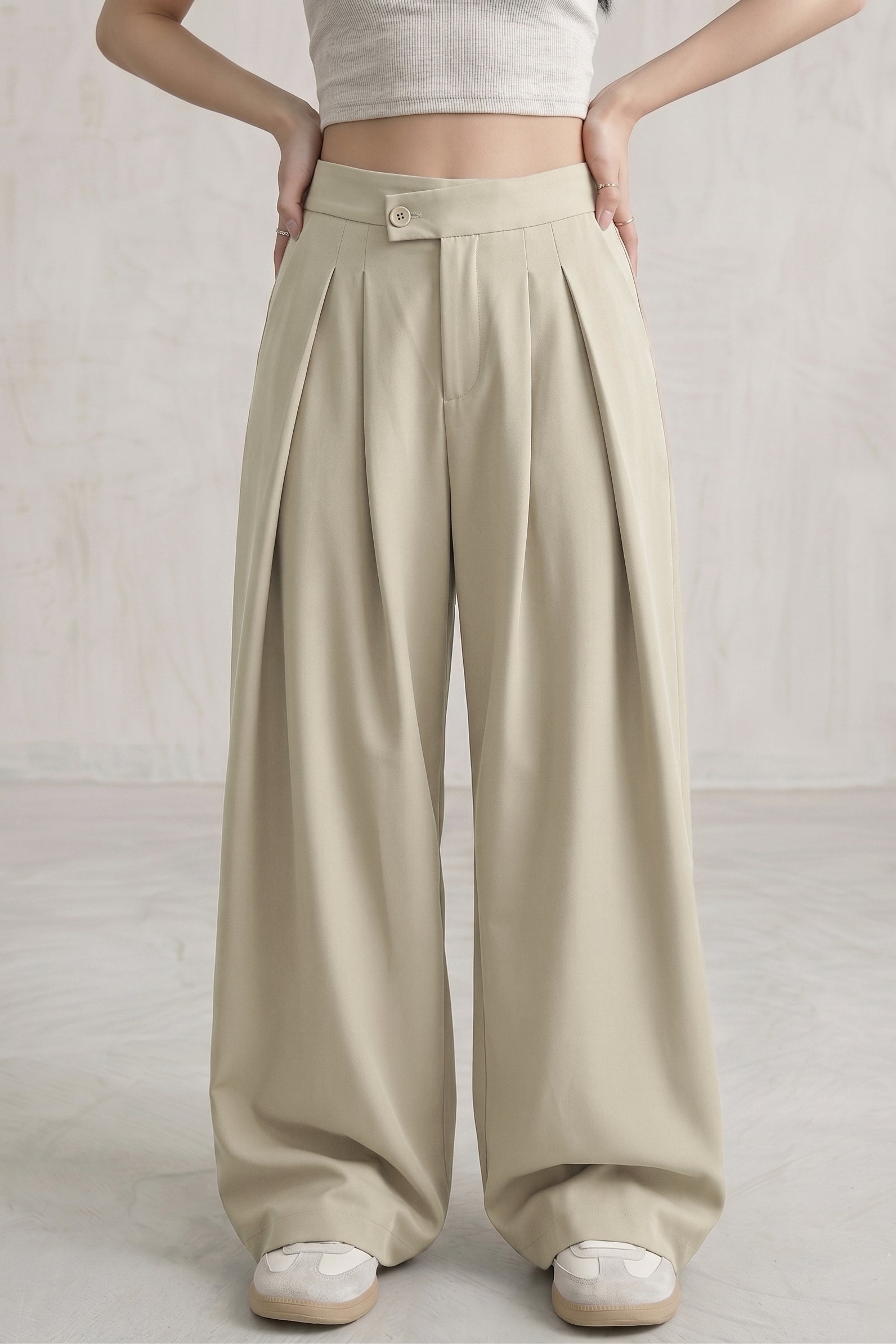 The Maeve Asymmetrical Pleated Trousers — Sage Cream