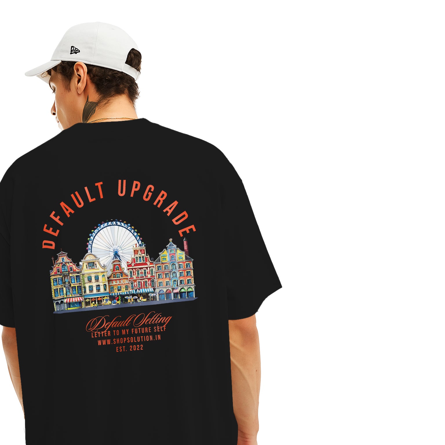 Person wearing a black t-shirt with colorful graphic and text on the back