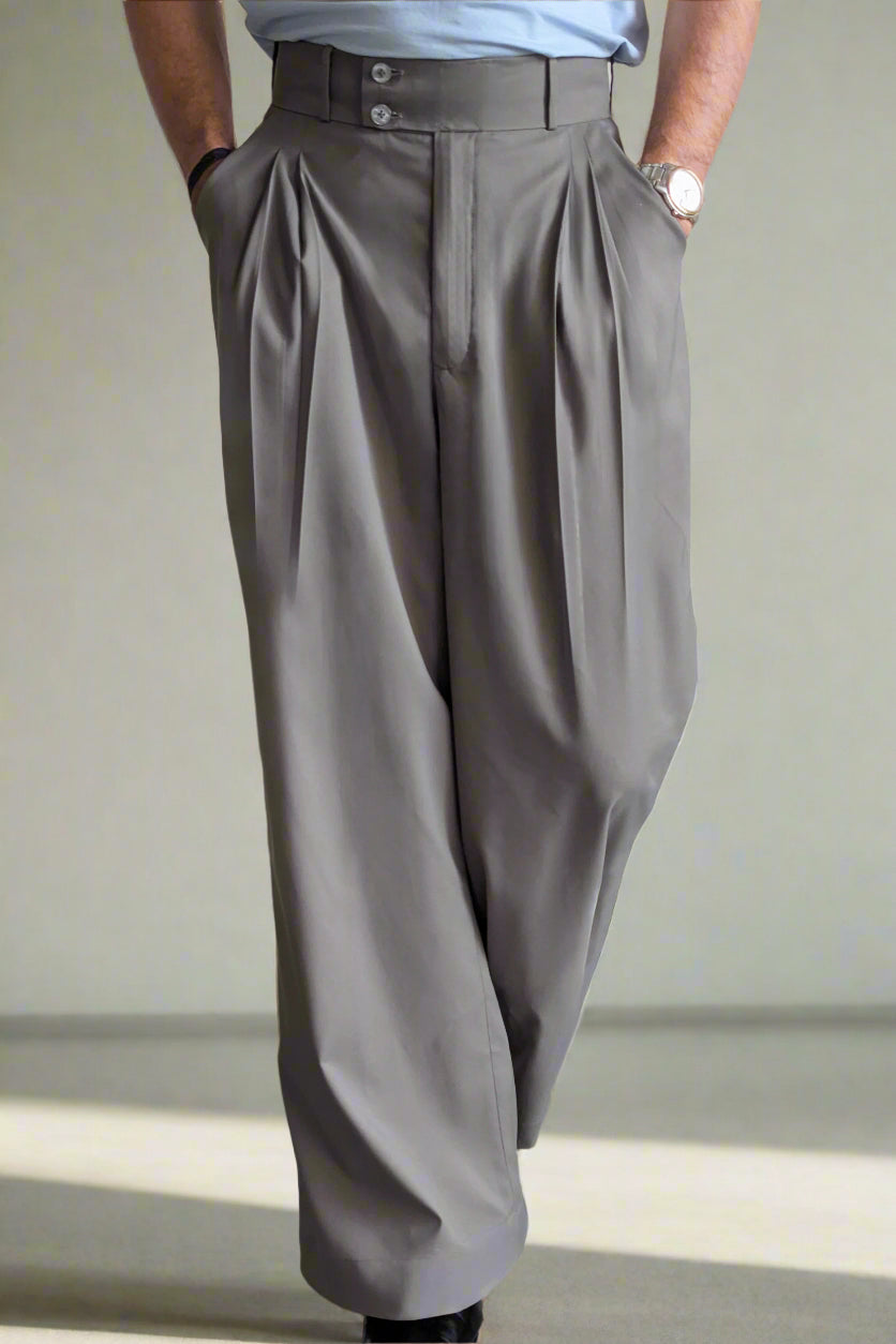 Gray wide-leg pants worn by a person on a plain background