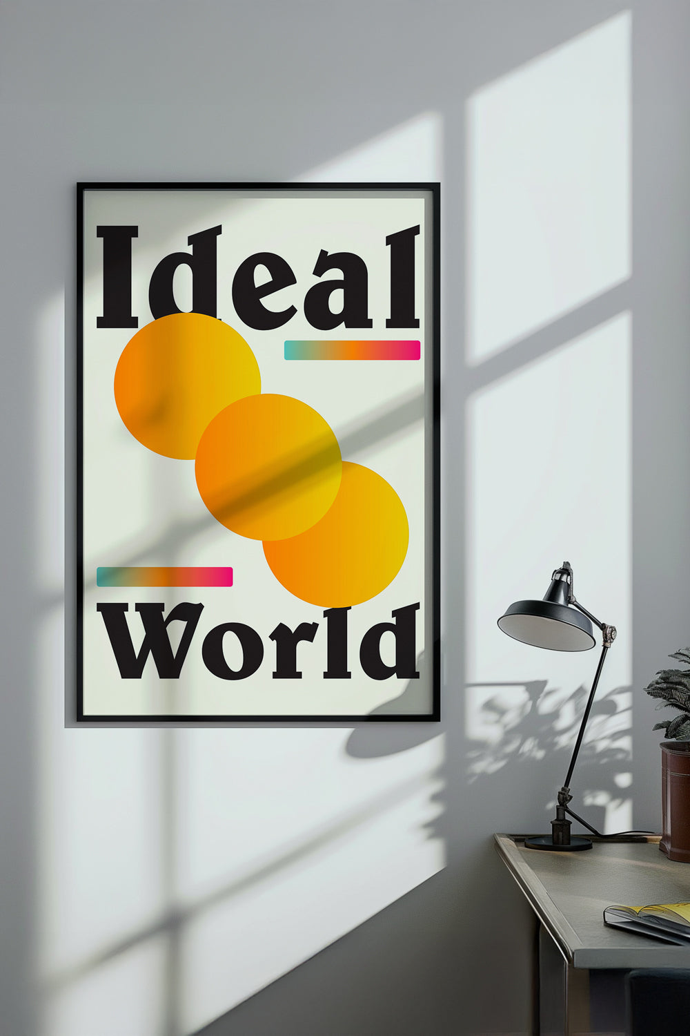 Poster with 'Ideal World' design on a wall in a room with a desk and lamp.