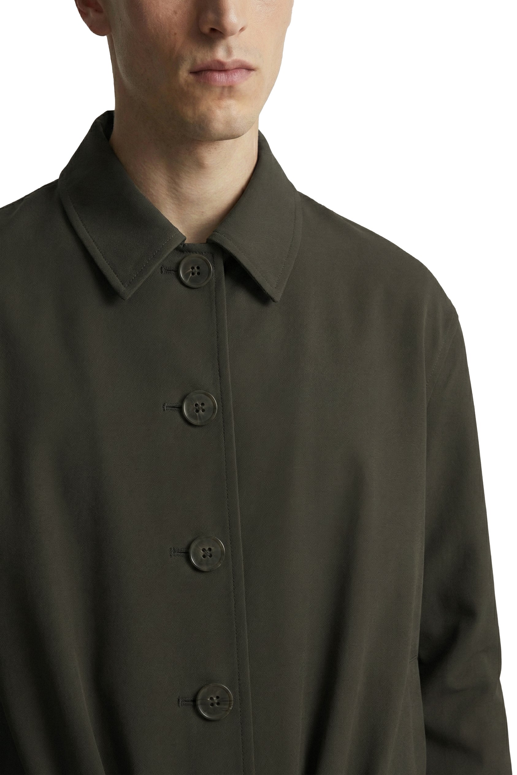 Dark green coat with button details on a white background