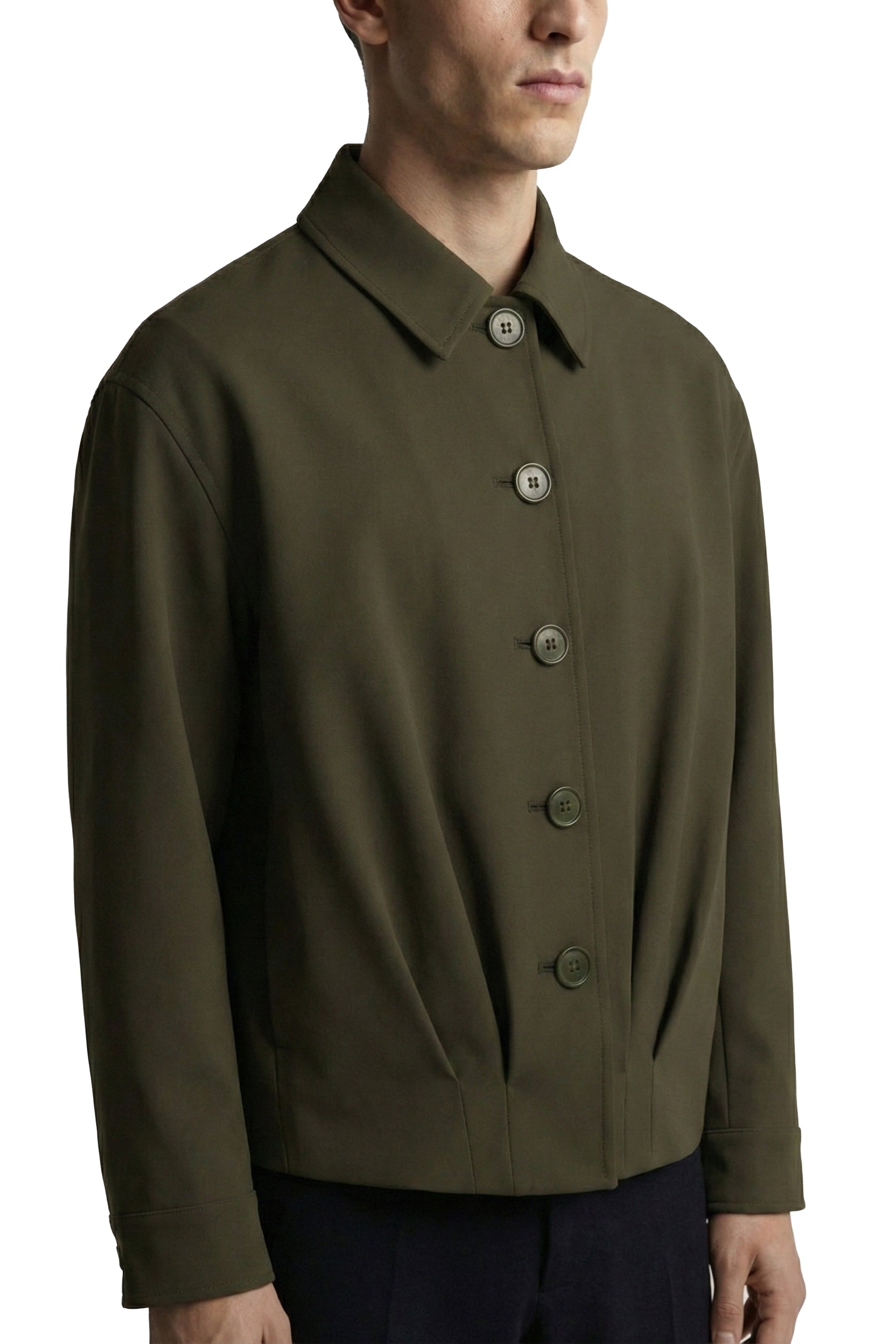 Man wearing a green jacket with buttons on a white background
