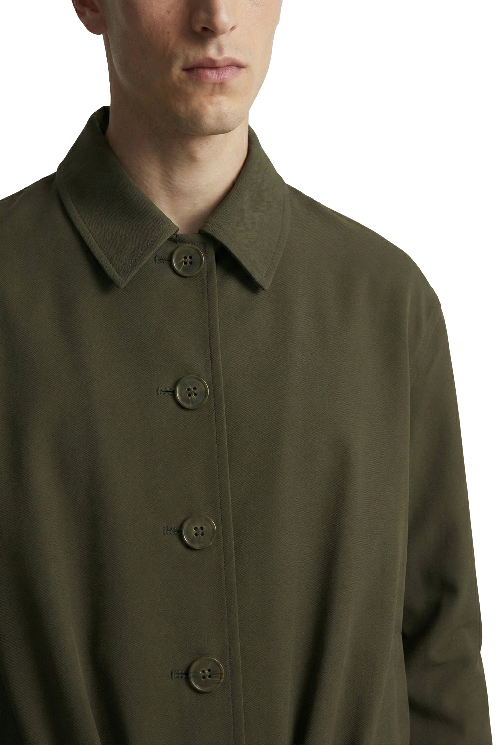 Green coat with button details on a white background