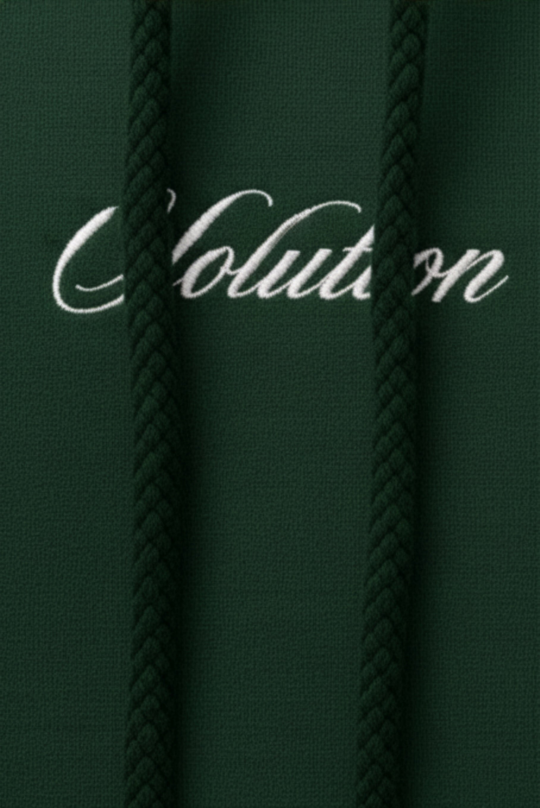 Dark green fabric with 'Evolution' embroidered in white thread