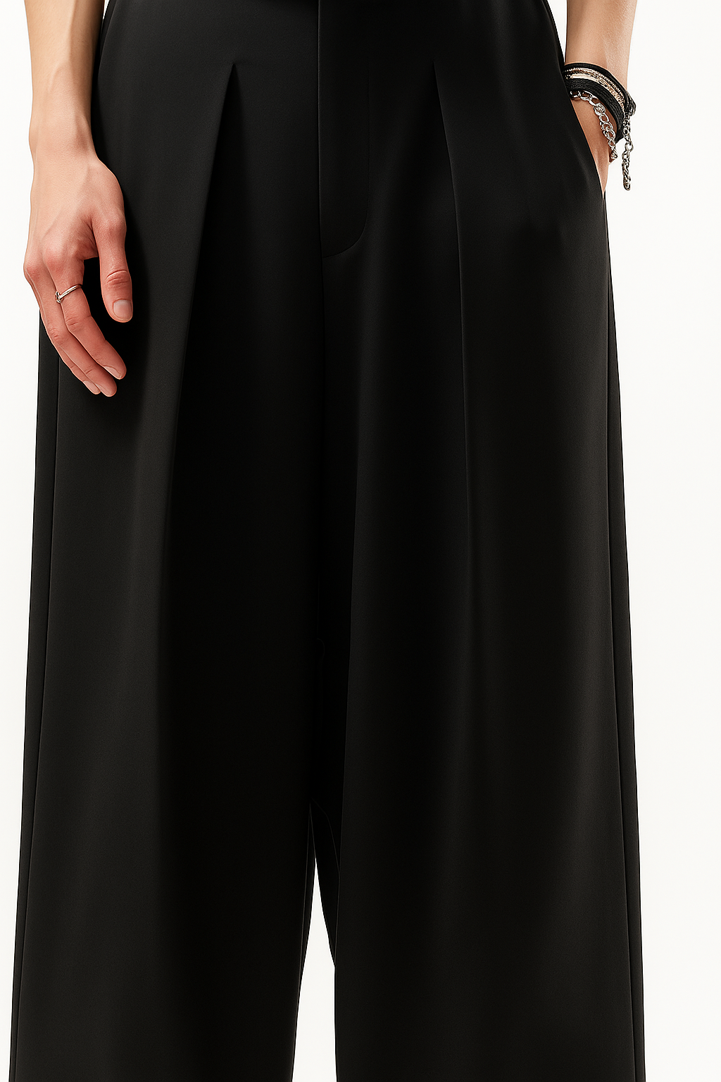 Black wide-leg pants worn by a person on a white background