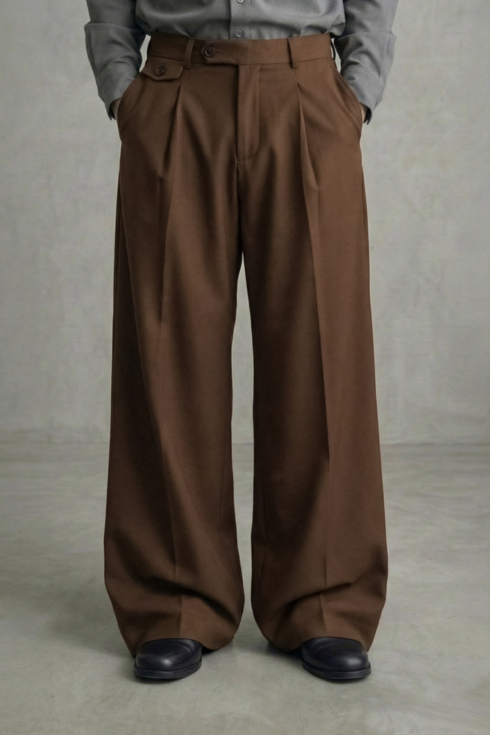 Brown wide-leg pants worn by a person on a plain background