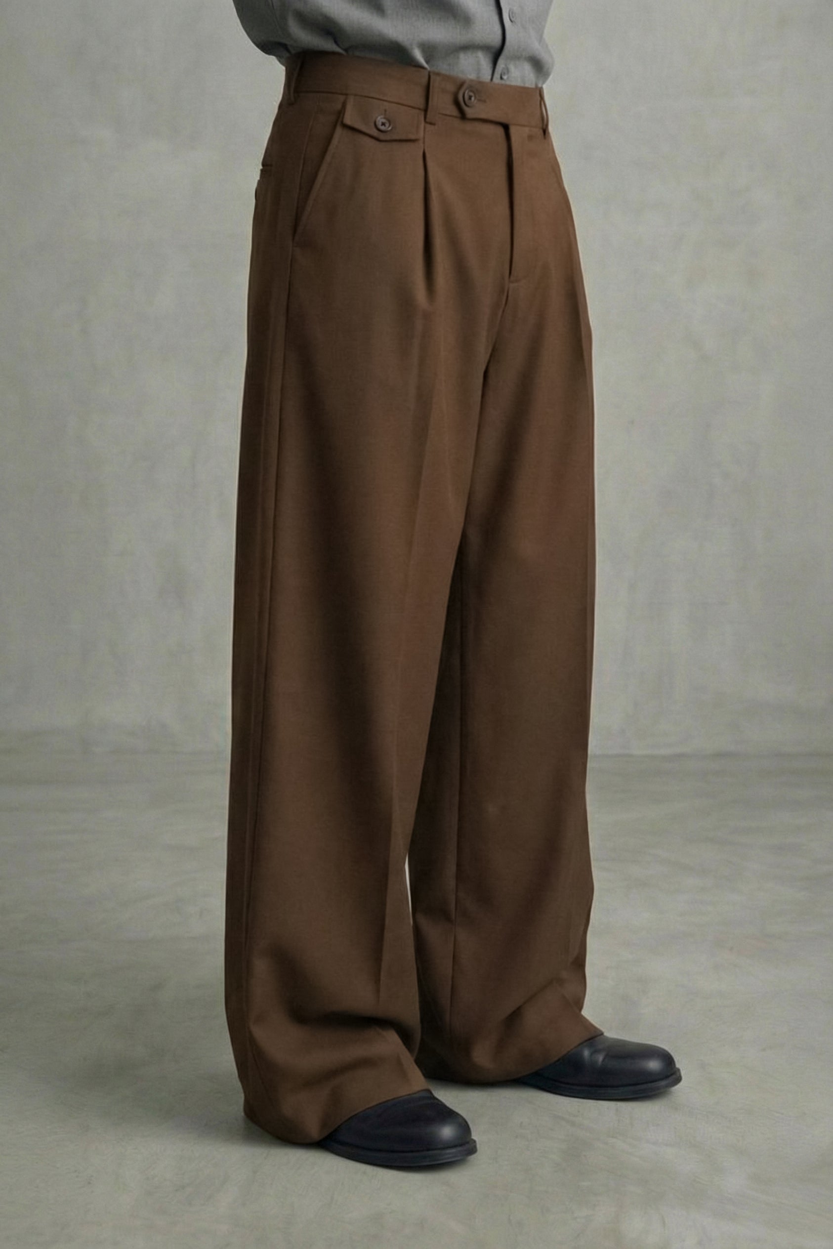 Brown wide-leg pants worn by a person on a plain background