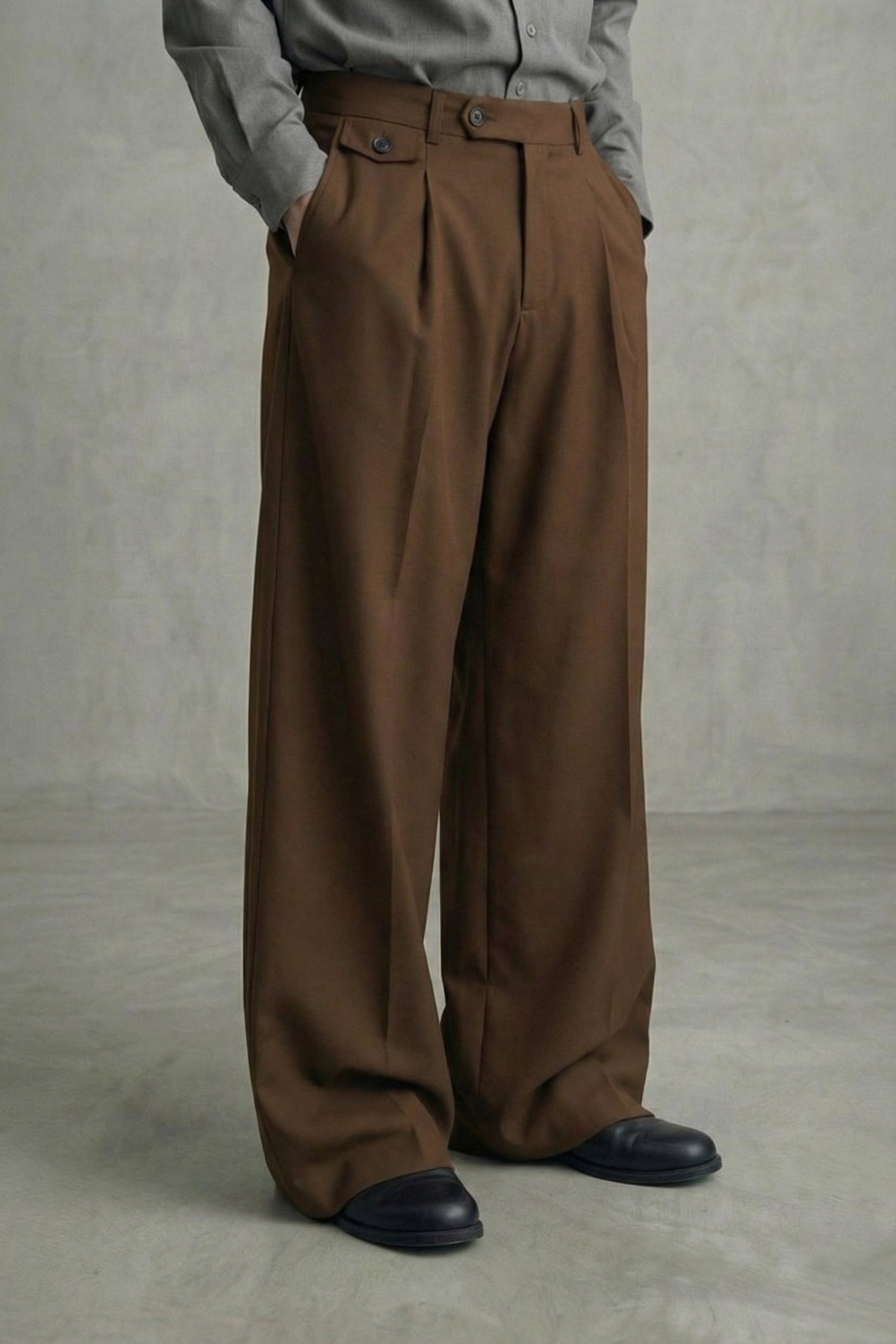 Brown wide-leg pants worn by a person on a plain background