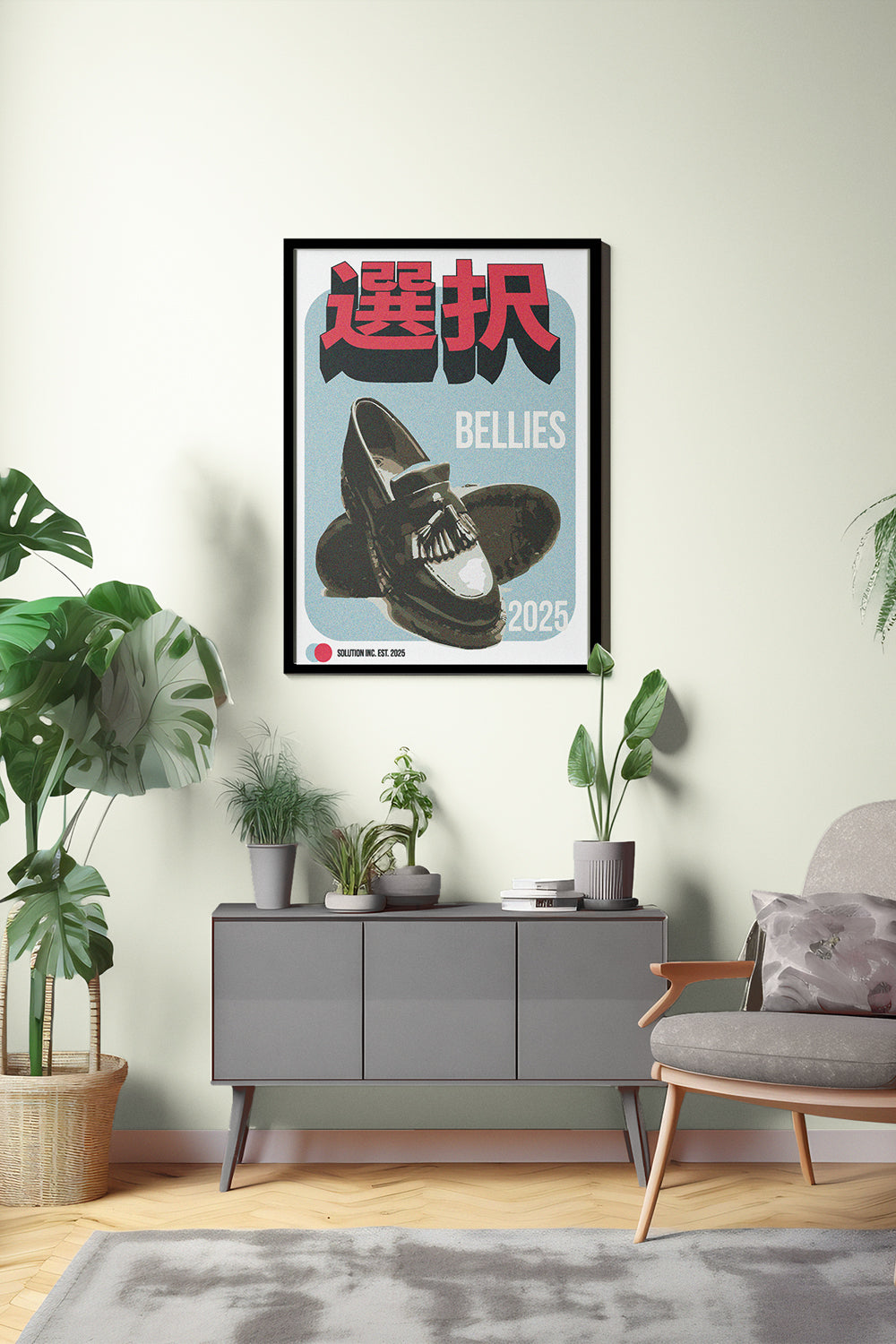 Framed poster of a shoe design on a wall above a side table with plants and a chair.