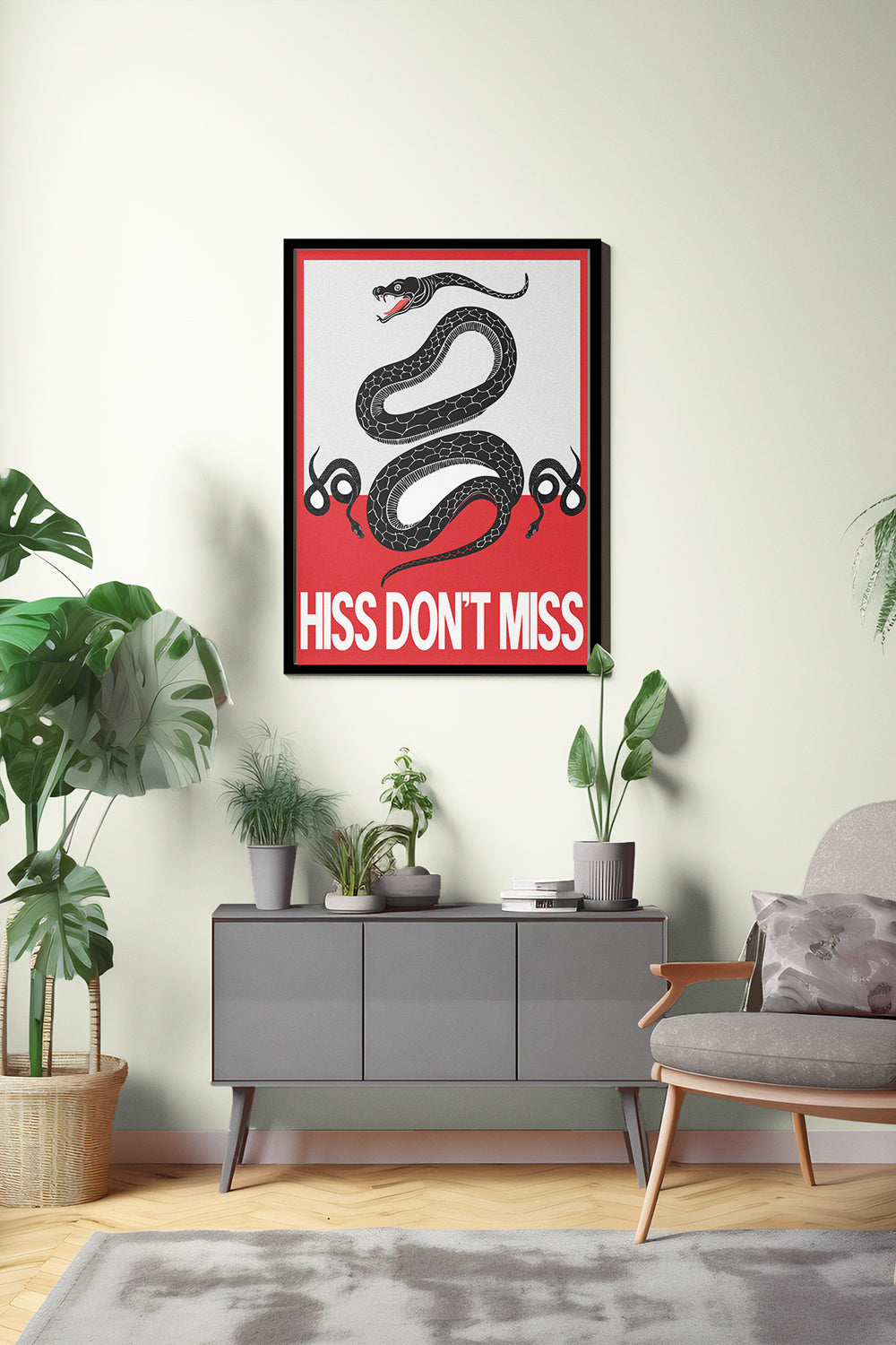 Framed poster with a snake design and text in a living room setting.