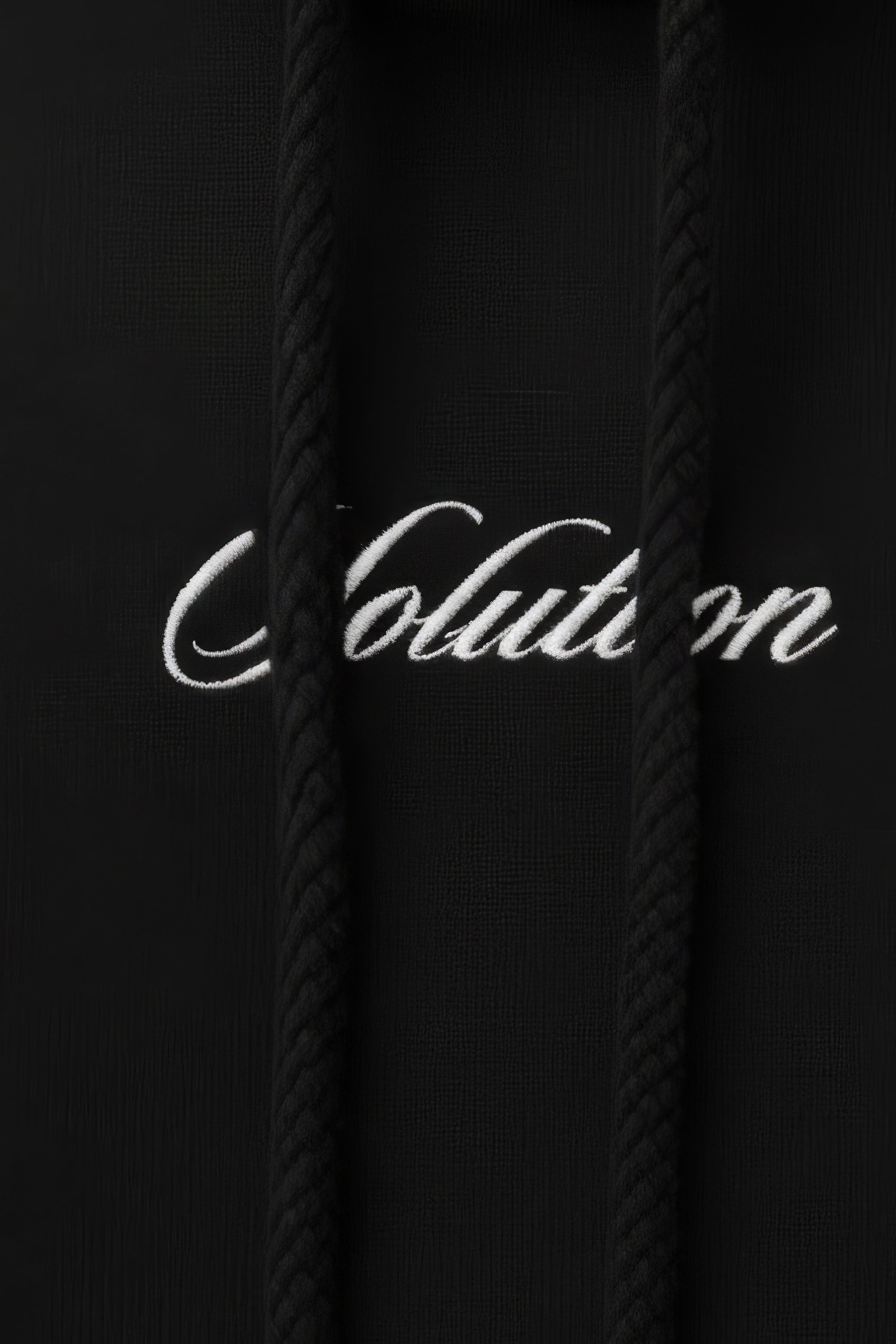 Black hoodie with 'Colution' logo on a dark background