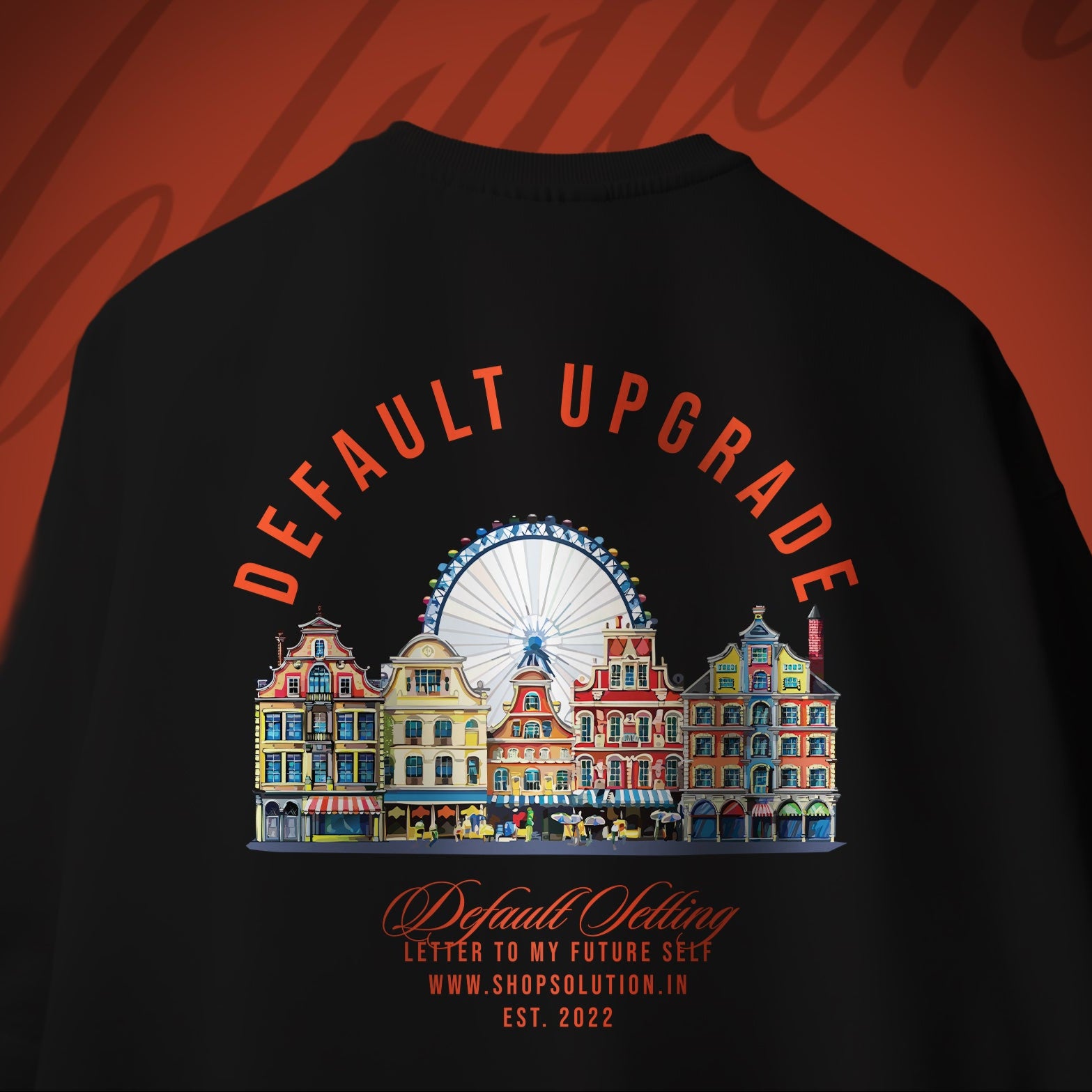 Black t-shirt with colorful graphic and text on a red background