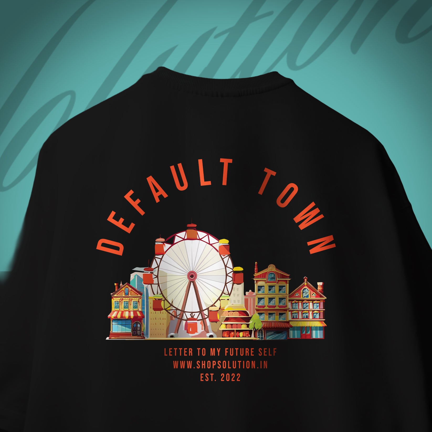 Black t-shirt with 'DEFAULT TOWN' graphic and ferris wheel design on a teal background