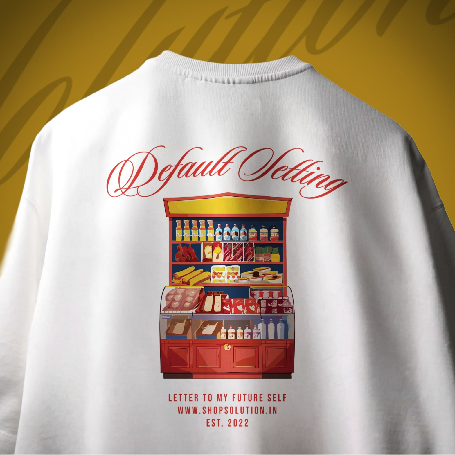 White t-shirt with a colorful illustration of a store and text on the back against a yellow background.